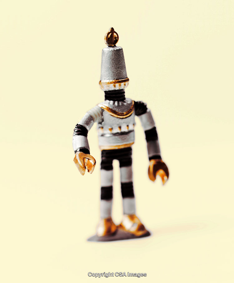 Vintage Metallic Robot Toy Figure on a Minimalist Background