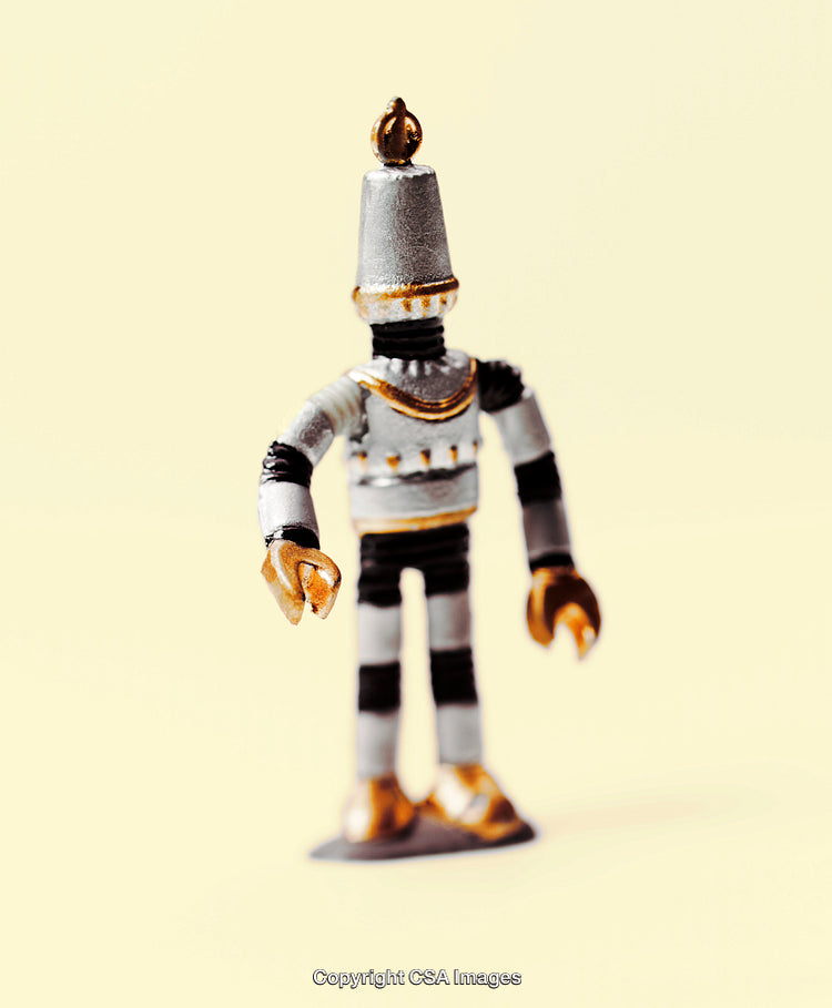 Vintage Metallic Robot Toy Figure on a Minimalist Background