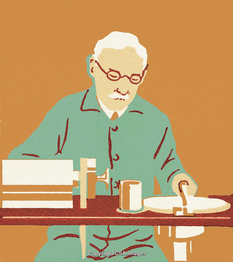 Older Man Sitting at a Table