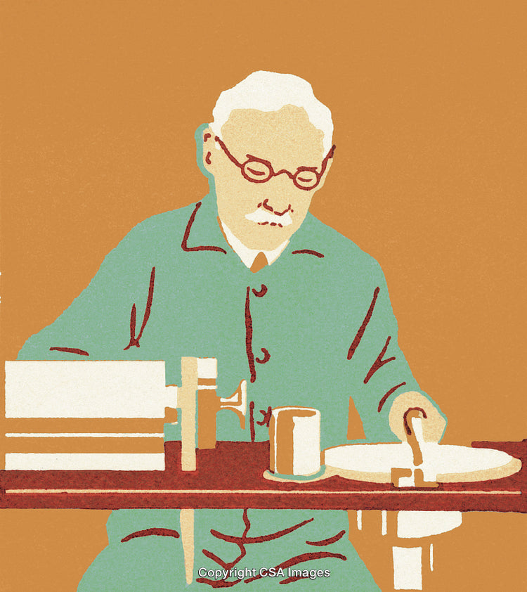 Older Man Sitting at a Table