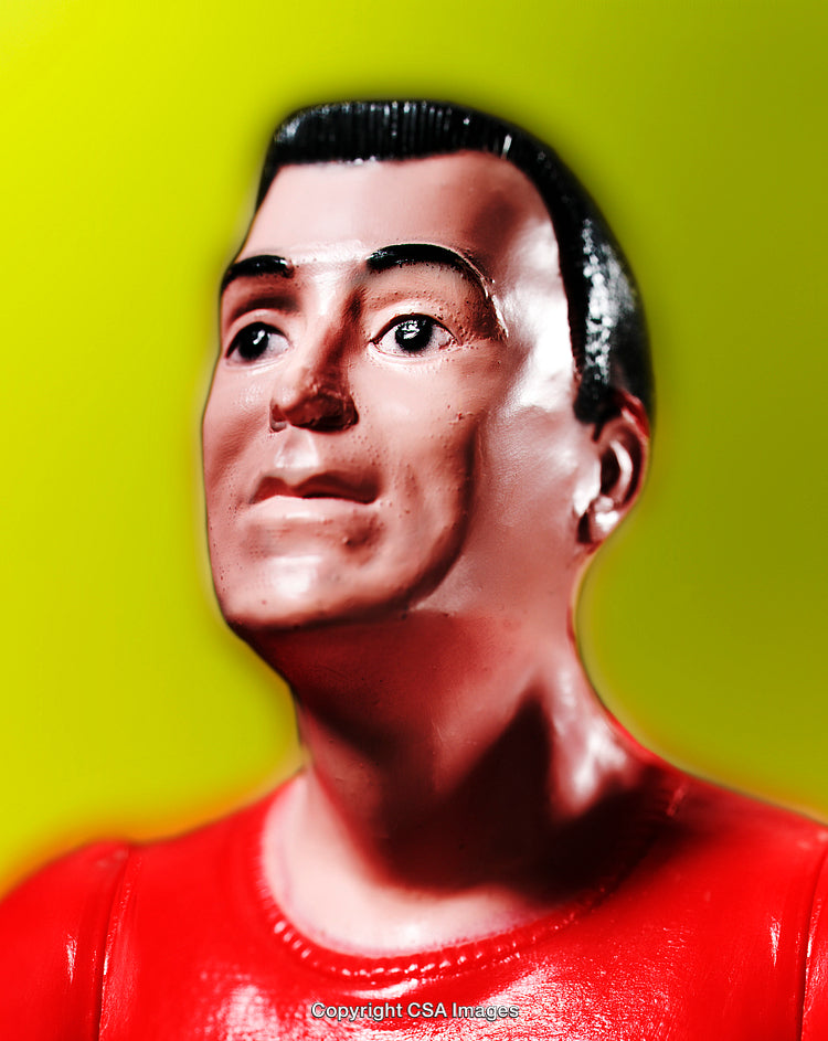 Close-Up of a Toy Figurine Against a Bright Yellow Background