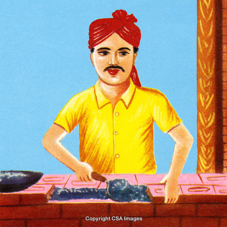 Traditional Chef Cooking Cuisine While Wearing a Colorful Attire