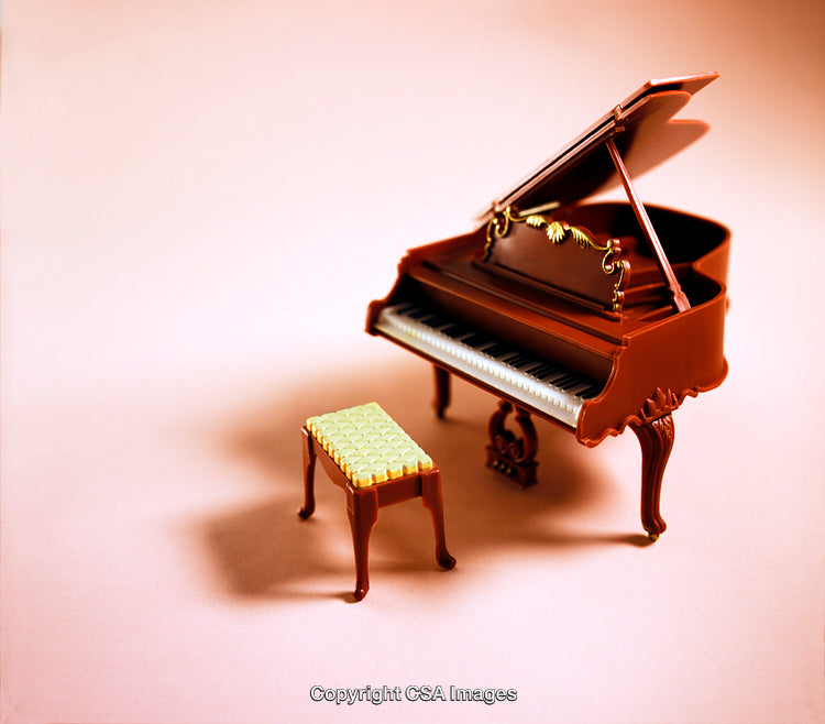 Miniature Grand Piano and Stool on a Soft Pastel Background