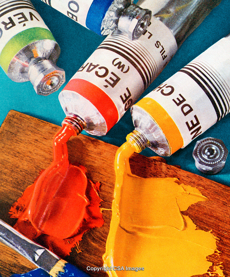 Close-Up of Paint Tubes and Colors Spread on Wooden Surface