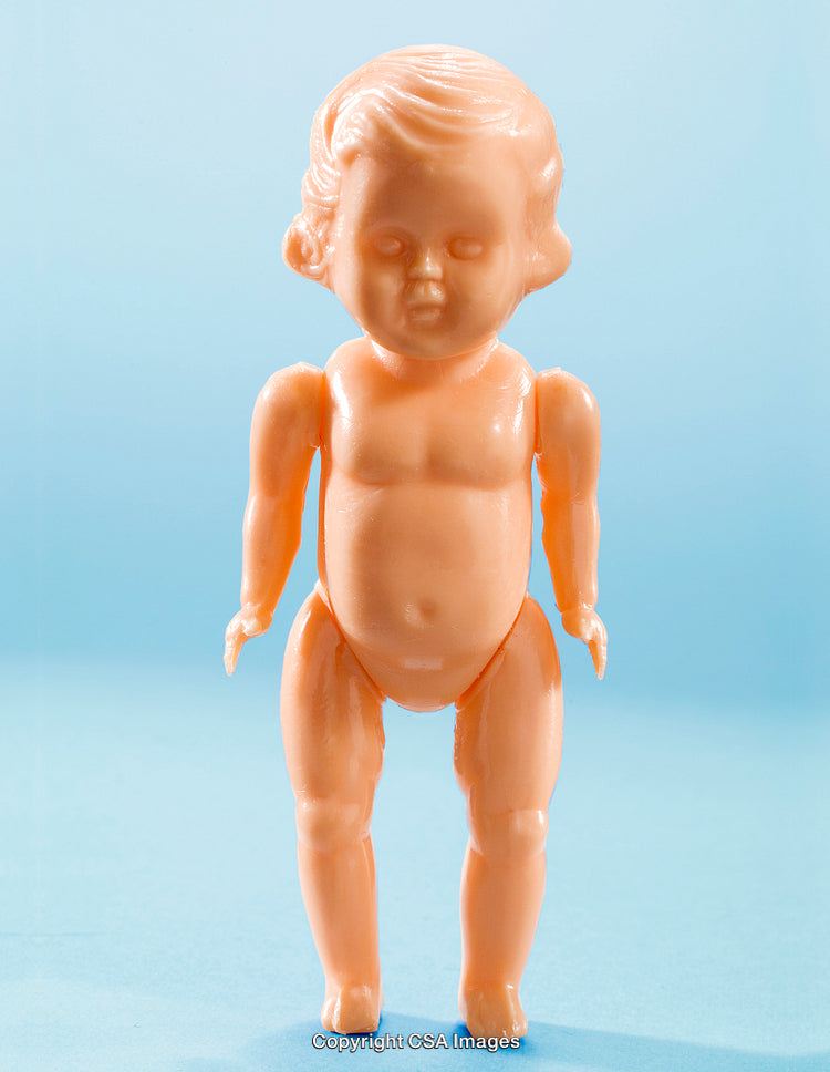 Vintage Blonde Plastic Doll on Blue Studio Background