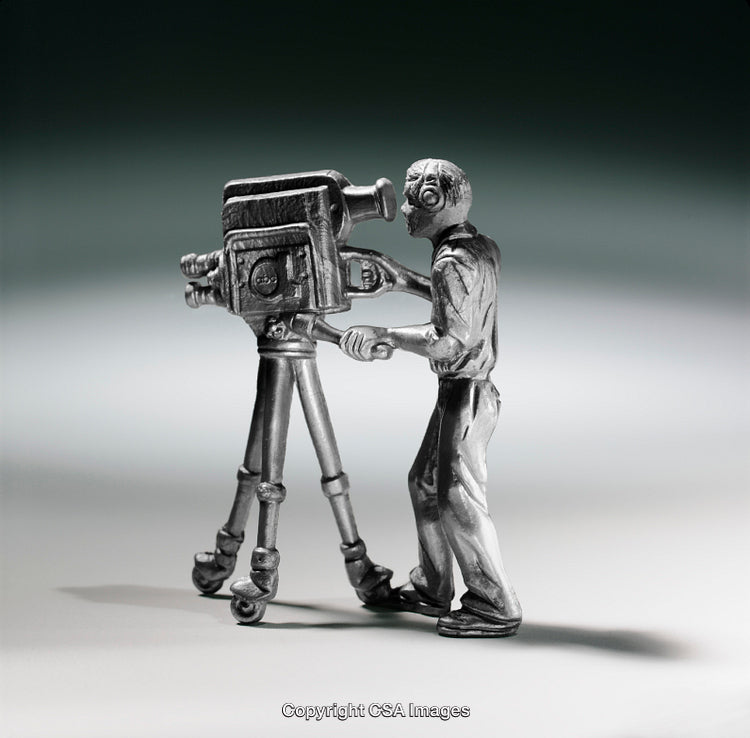 Silver Figurine of Cameraman Operating Vintage Film Camera on Tripod