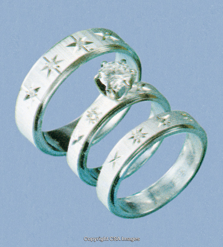 Elegant Silver Wedding Bands Featuring Star Engravings and Sparkling Design