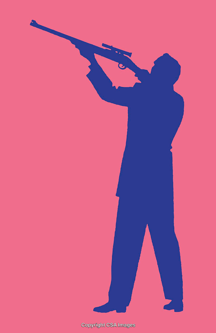 Silhouette of a Rifle Shooter With Bright Contrasting Background