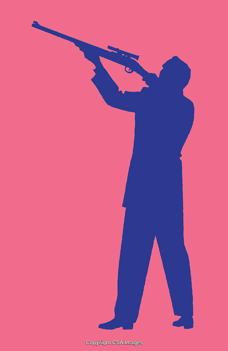 Silhouette of a Rifle Shooter With Bright Contrasting Background