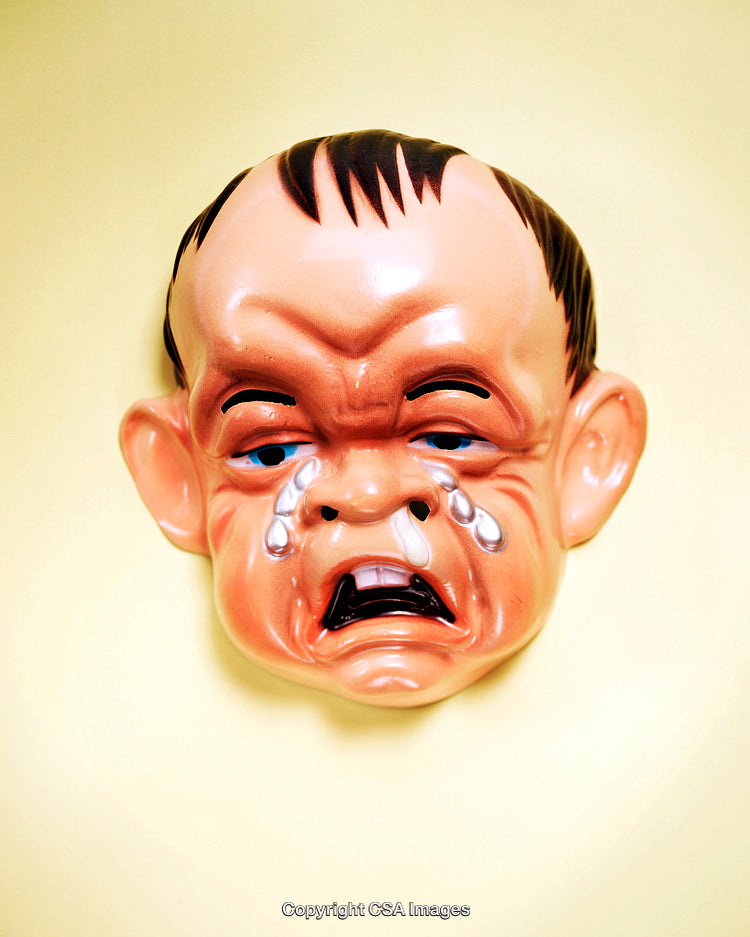 Funny Crying Baby Mask on Pastel Yellow Background