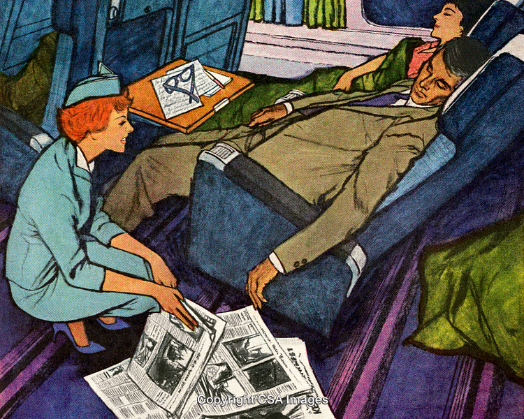 Flight Attendant Assisting Sleeping Passengers In Airplane Cabin
