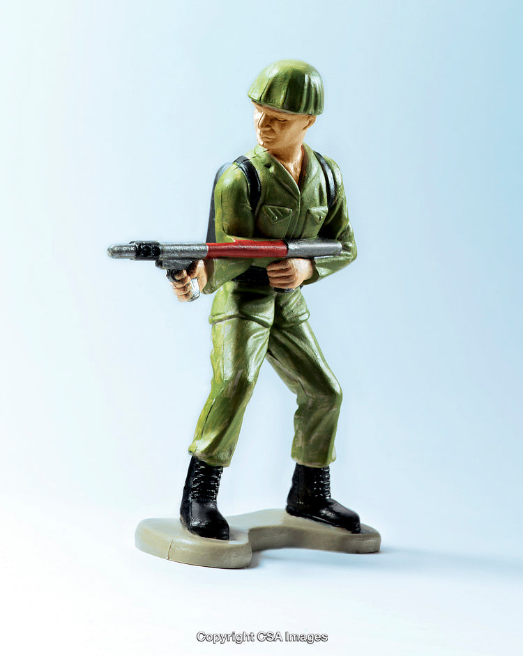 Green Plastic Soldier Figure Holding a Weapon in a Stance