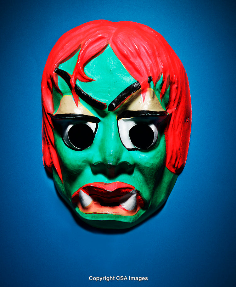 Vibrant Green Monster Mask with Red Hair and Blue Background