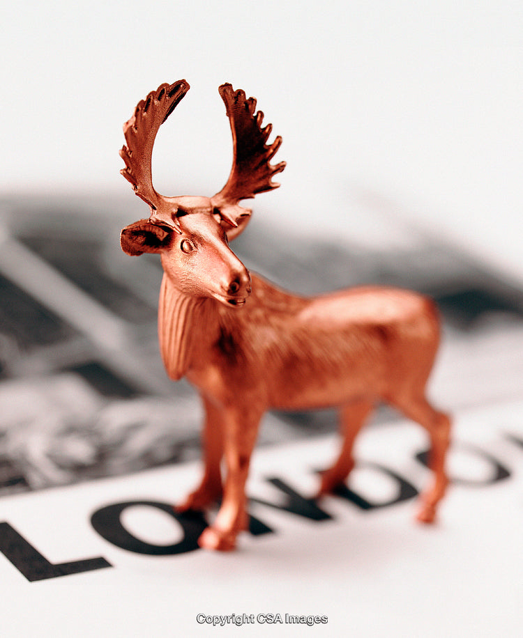 Copper Tone Moose Figurine on Abstract London Text Illustration