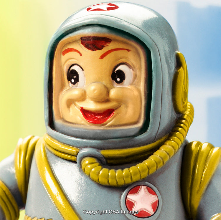 Cheerful Plastic Astronaut Toy with Retro Details and a Bright Smile