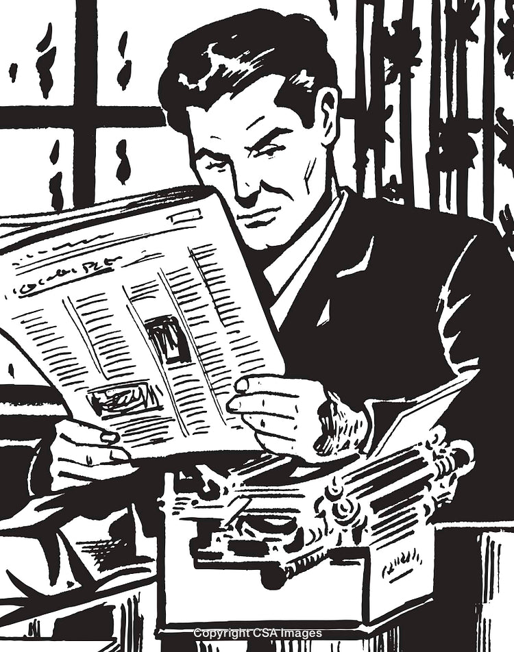 Man Reading Newspaper While Sitting at Desk with Vintage Typewriter