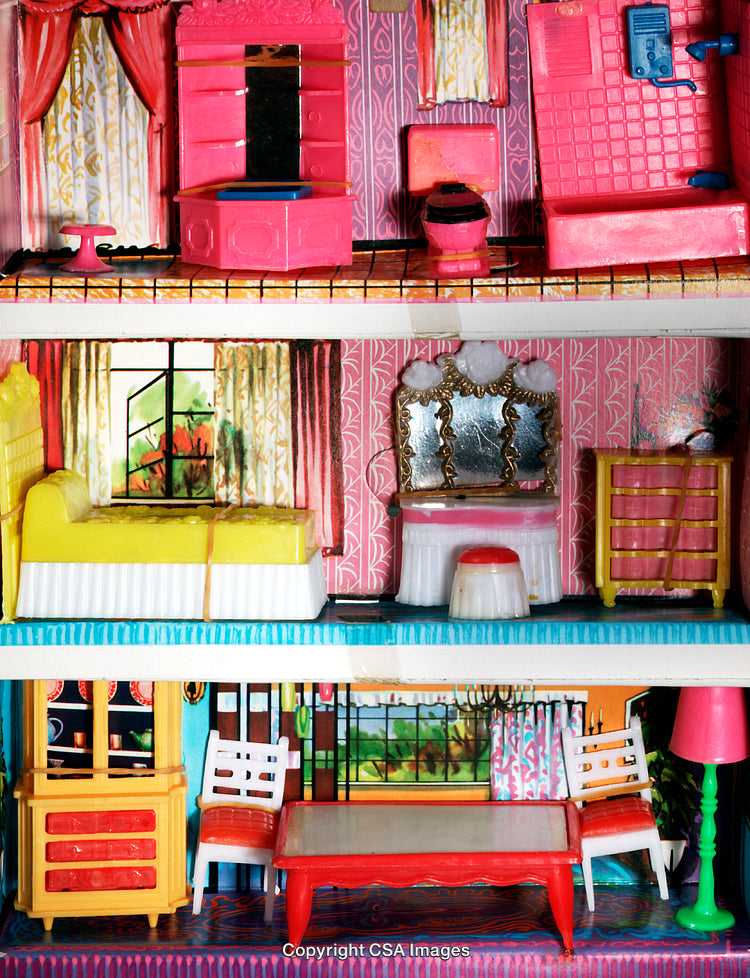Close-Up of a Vintage Plastic Dollhouse With Furniture and Vibrant Colors