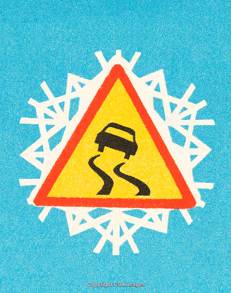 Warning Sign on Snowy Background Indicating Slippery Road Surface in Winter