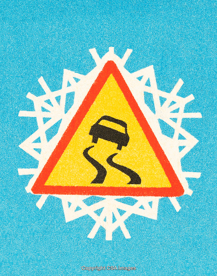 Warning Sign on Snowy Background Indicating Slippery Road Surface in Winter