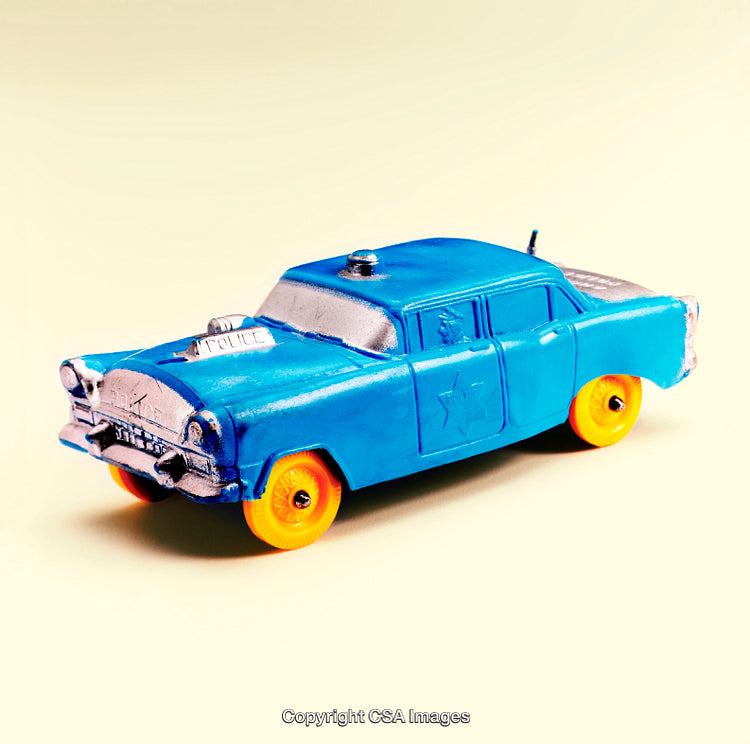 Close-Up of a Blue Toy Police Car with Vibrant Wheels