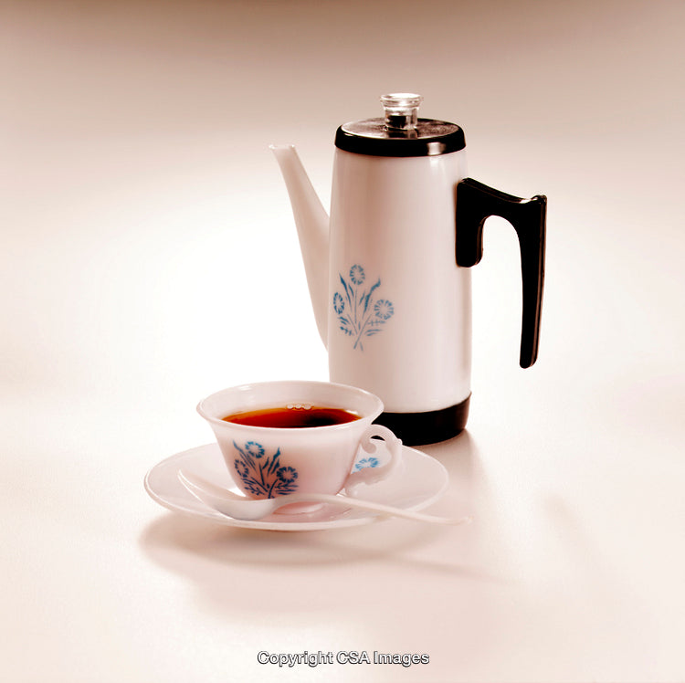Vintage Style Ceramic Tea Set with Floral Design in a Minimalist Setting