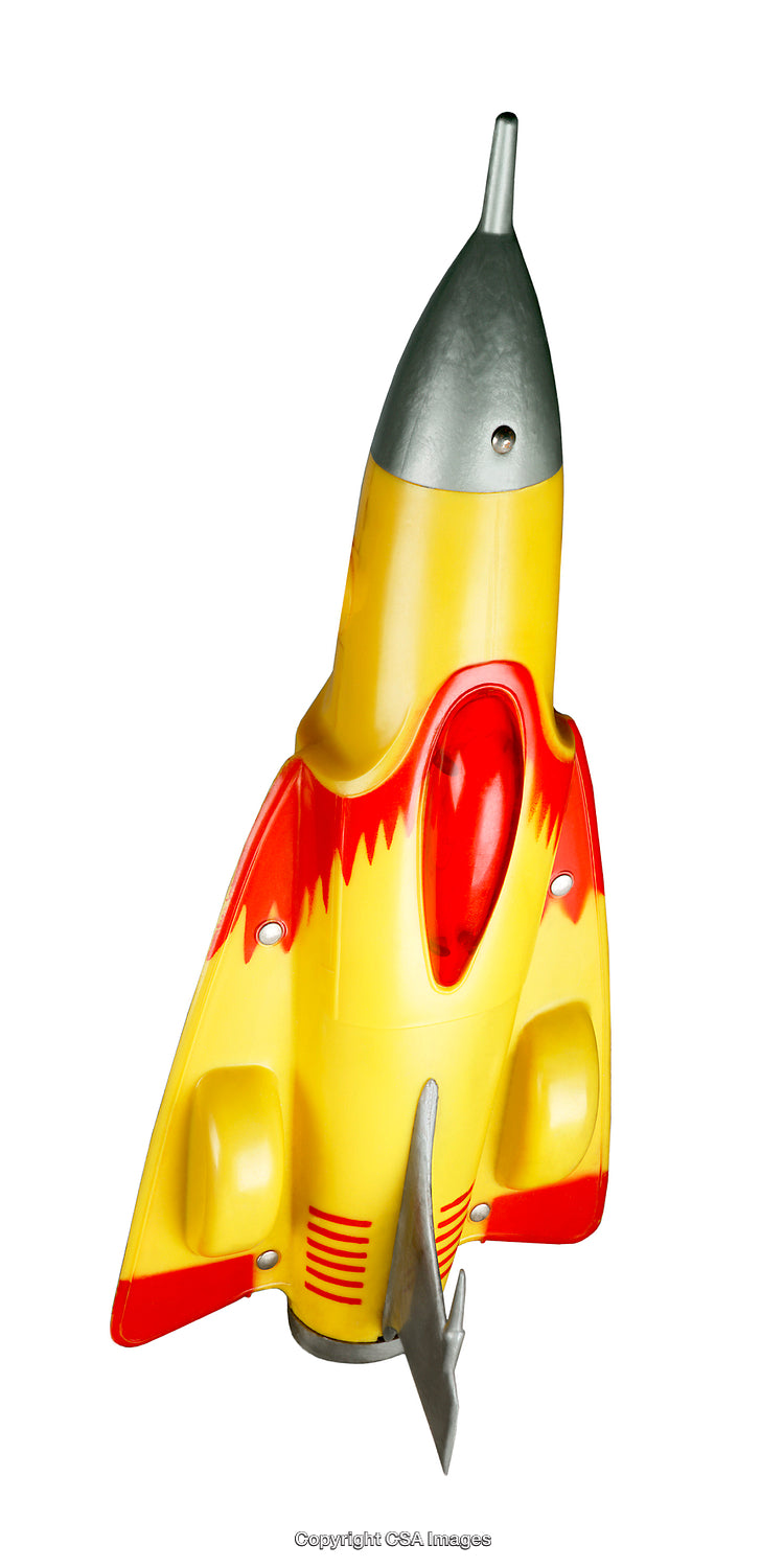 Retro Styled Yellow and Red Rocket Ship Plastic Toy Isolated on White