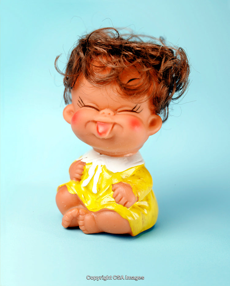 Adorable Plastic Figurine of a Smiling Child Wearing Yellow Dress