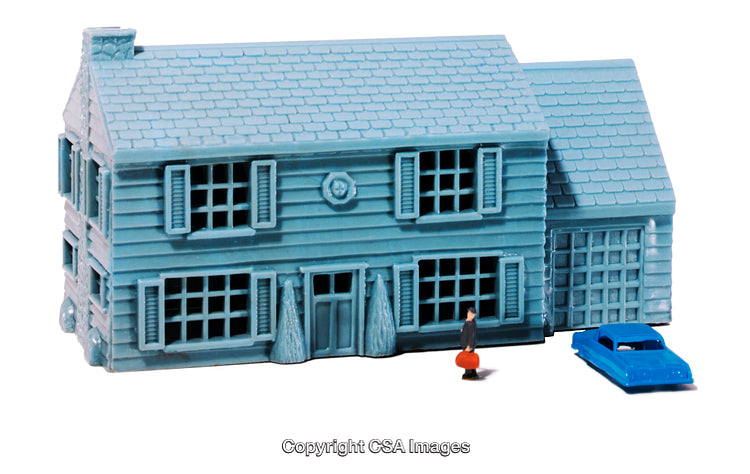 Blue Toy House with Figurine and Blue Toy Car Beside It