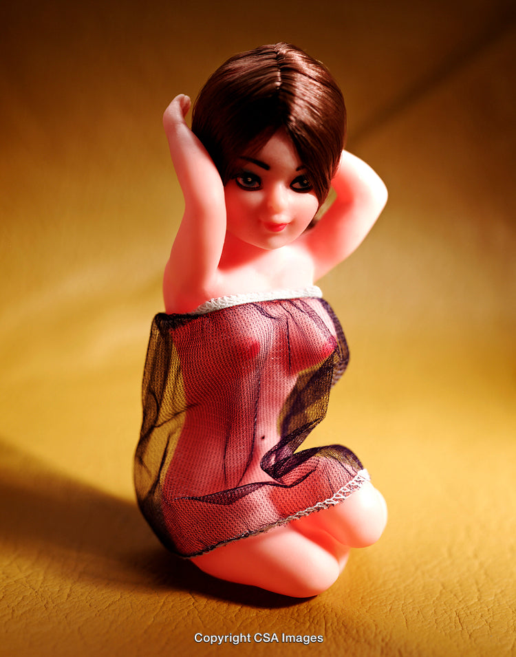 Close-Up of a Fashionable Plastic Doll in Elegant Pose