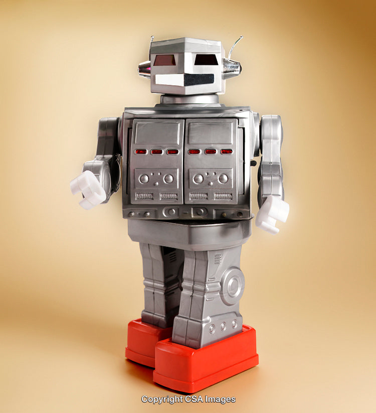 Vintage Robot Toy With Silver Body and Red Feet on Yellow Background
