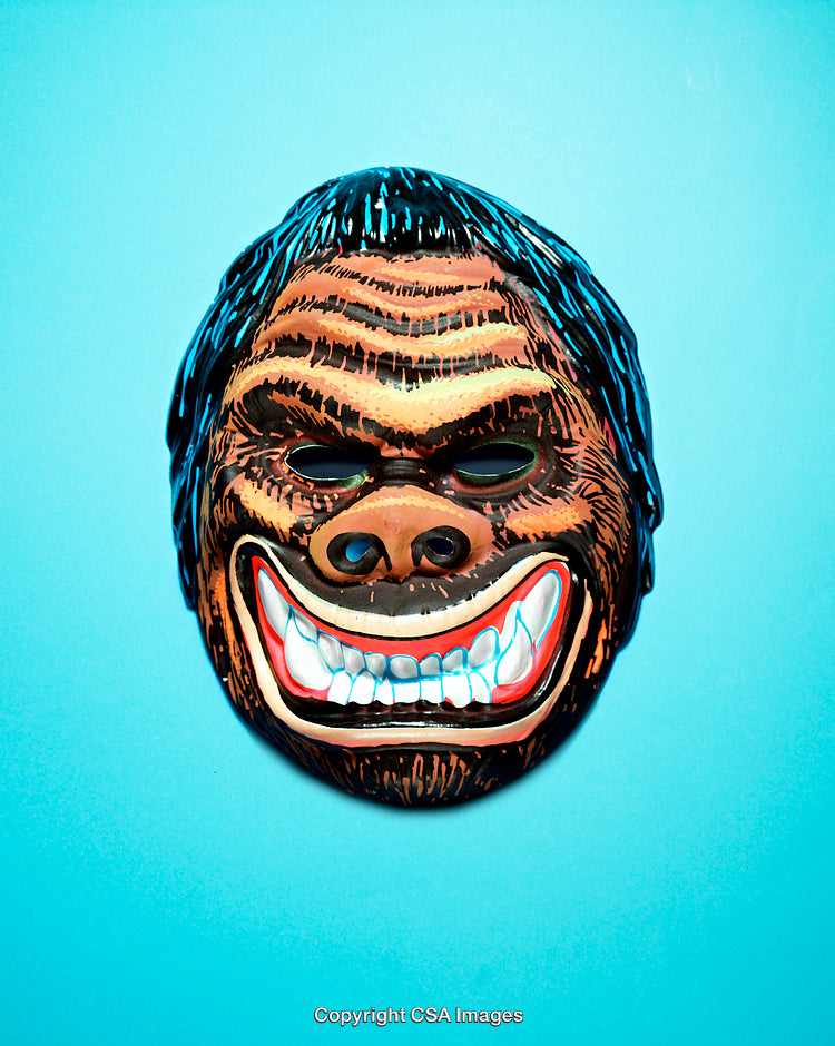 Close-Up of a Vibrant Gorilla Mask on Blue Background