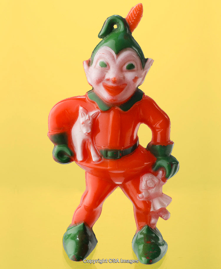 Colorful Plastic Elf Toy with Accessories Against Yellow Background