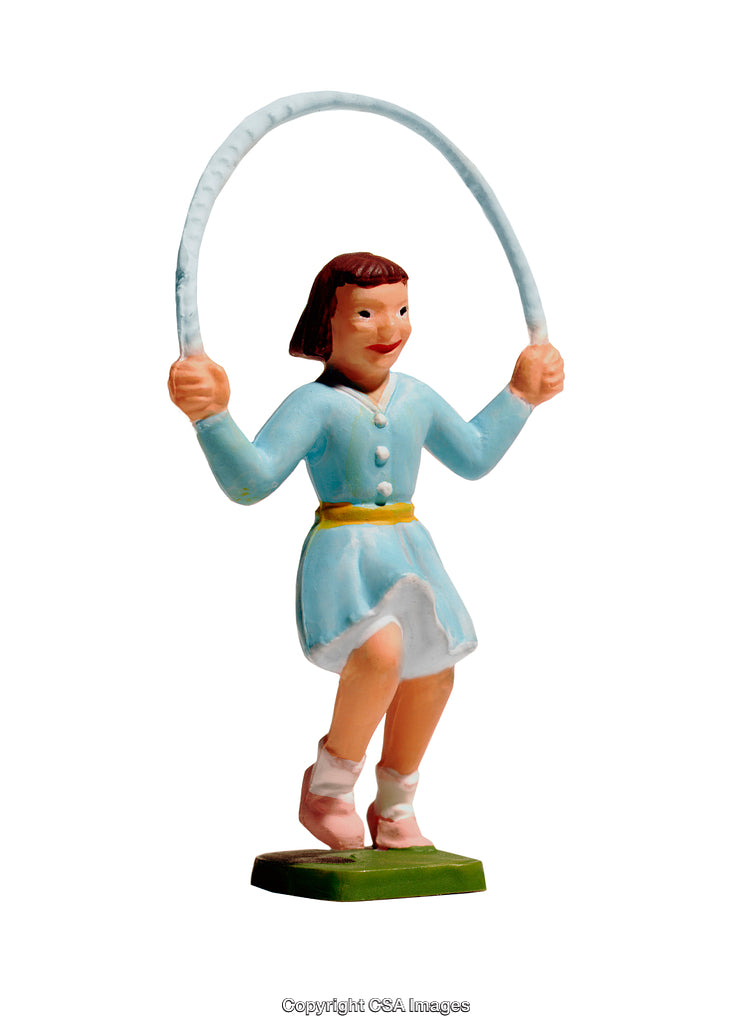 Vintage Figurine of Child Skipping Rope in Cheerful Play