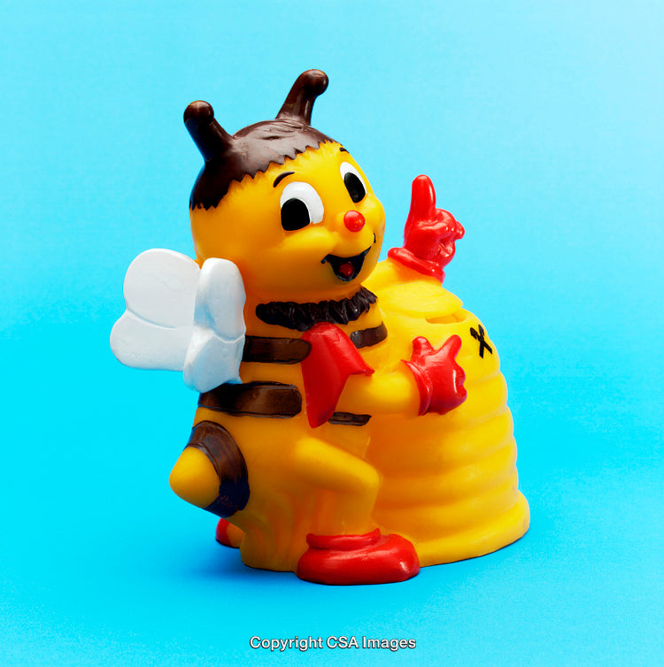 Colorful Bee-Themed Plastic Toy Figurine On Bright Blue Background