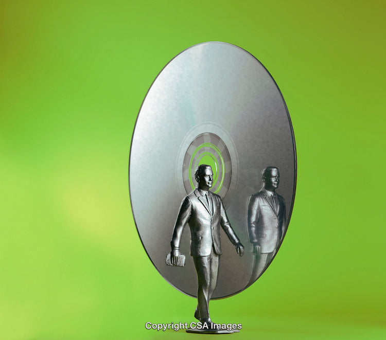 Miniature Businessperson Figure with Reflective CD Disc and Green Backdrop