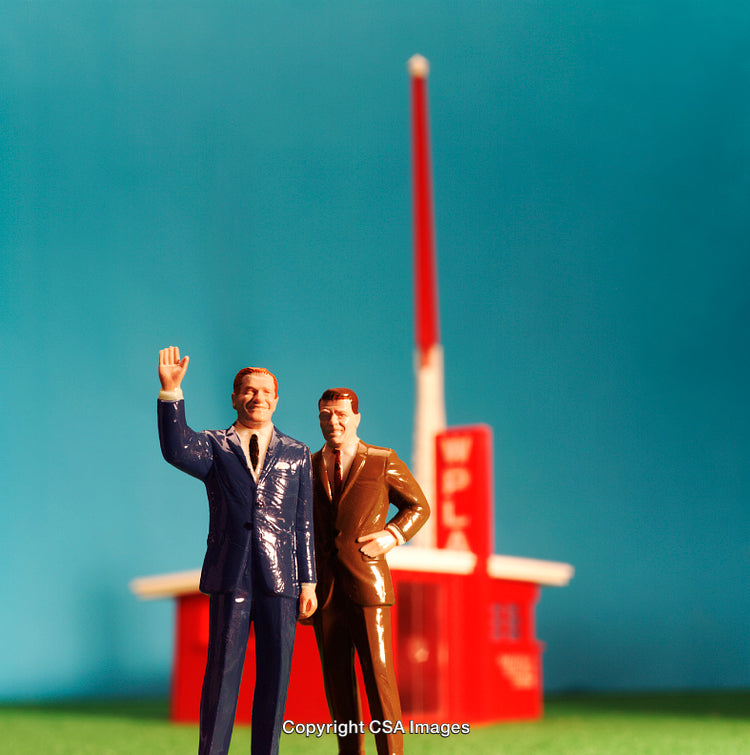 Miniature Figurines in Front of a Colorful Retro Background
