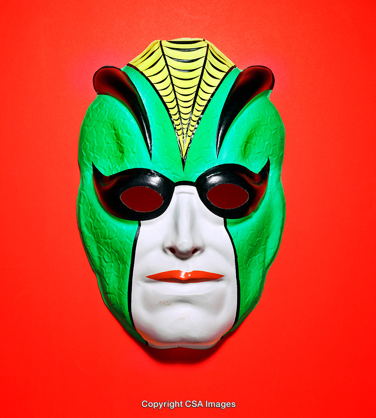 Green Insect-Themed Mask Displayed on Bright Red Background