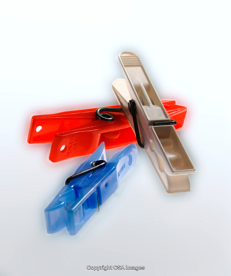 Plastic Clothespins in Vibrant Colors Arranged on White Background