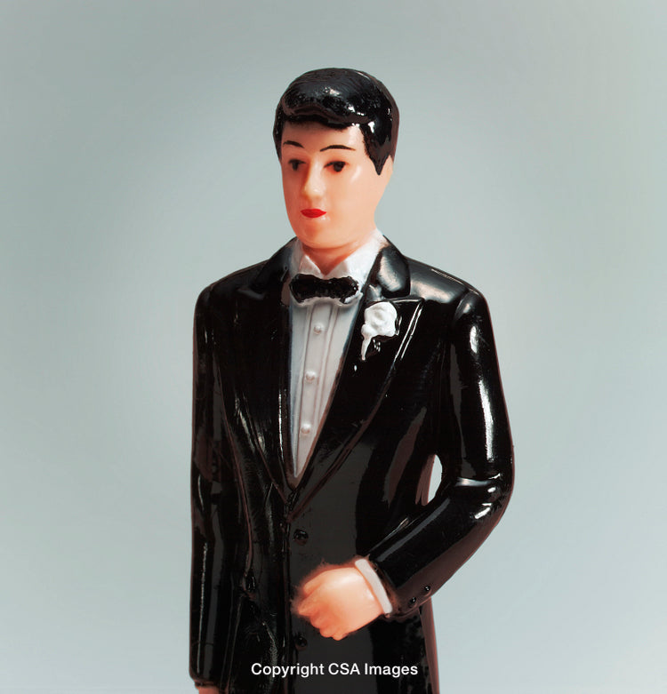 Close-Up of Groom Figurine in Formal Wedding Tuxedo