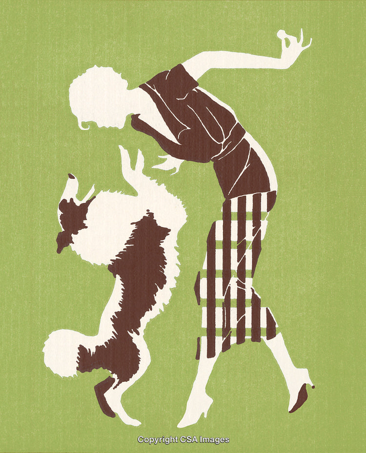 Elegant Woman Interacting Joyfully with a Graceful Dog on Green Background