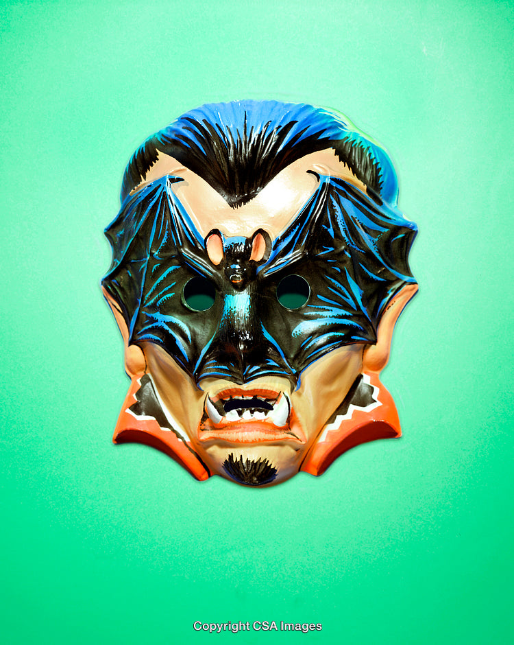 Decorative Vampire Mask with Bat Motif on Vibrant Green Background
