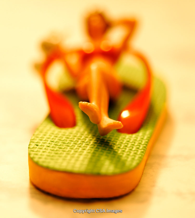 Close-Up of Plastic Toy in Relaxed Summer-Themed Setting