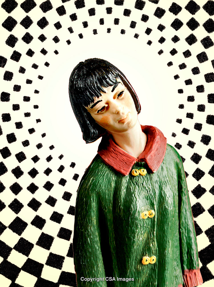 Close-Up of a Stylized Figurine With Geometric Background