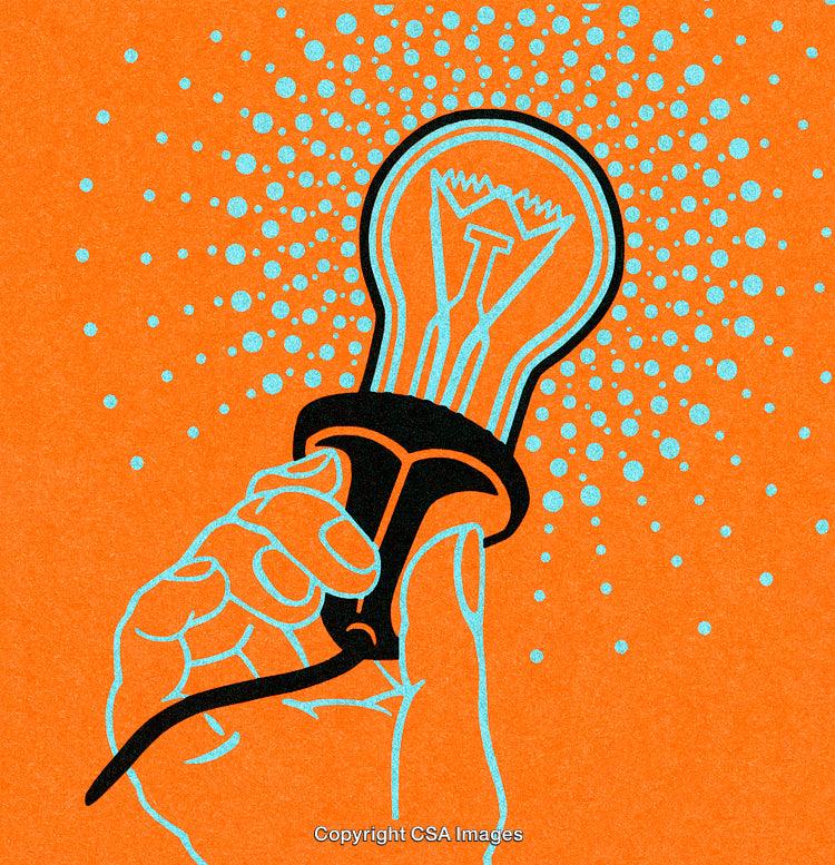 Hand Holding Light Bulb Symbolizing Creativity and Innovative Ideas on an Orange Background