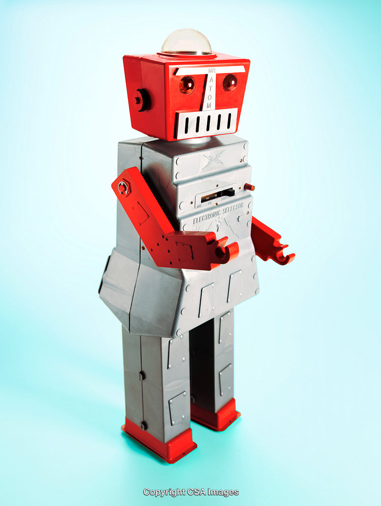 Retro Toy Robot Figurine With Vintage Design on Light Blue Background