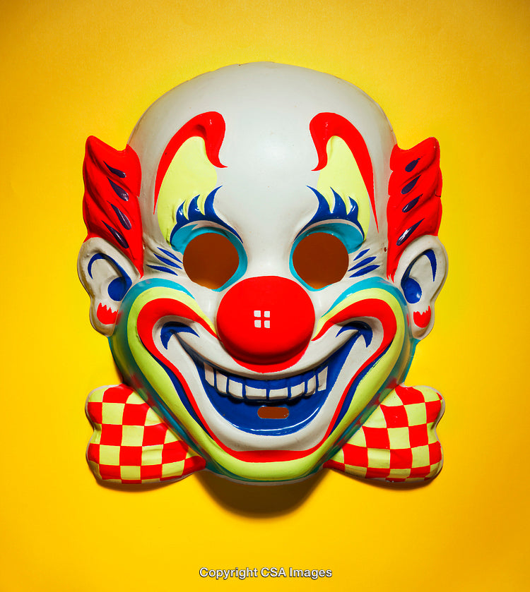 Colorful Clown Mask on Bright Yellow Background