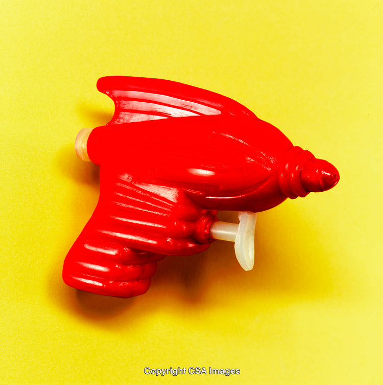 Vibrant Retro Style Plastic Toy Gun on a Yellow Background