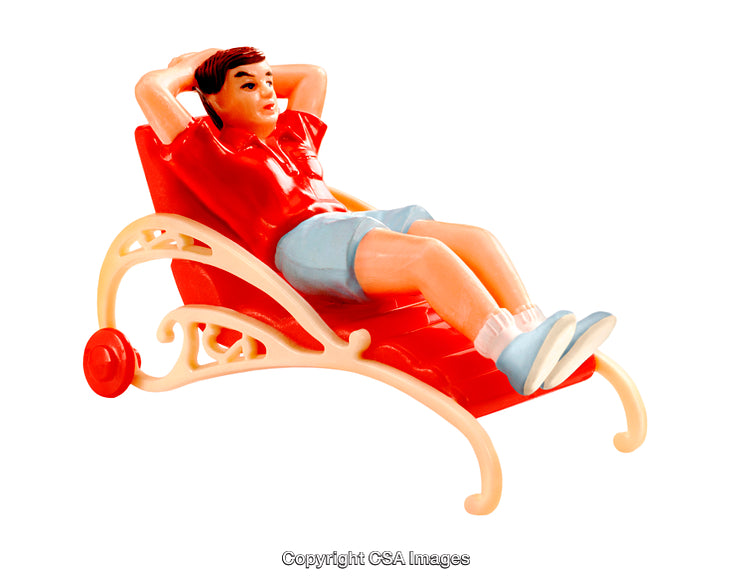 Plastic Toy Figurine Relaxing on a Colorful Ornate Lounge Chair