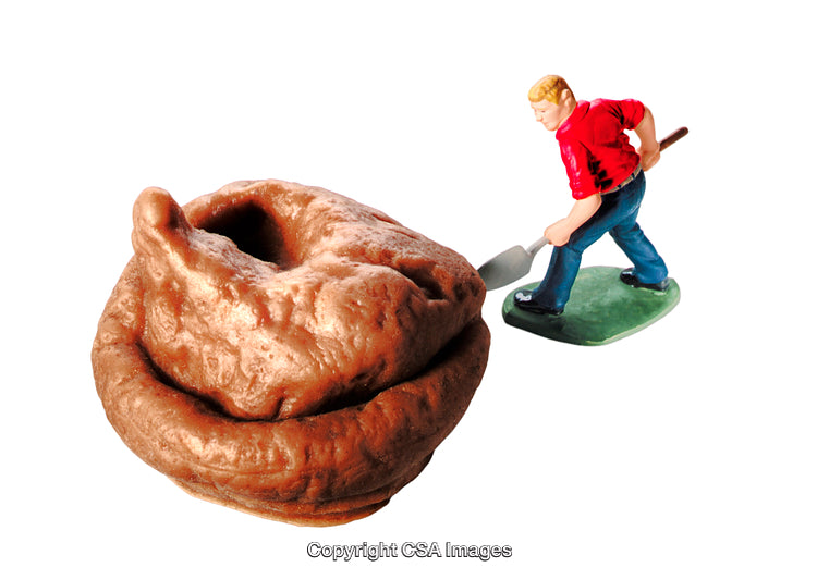 Miniature Plastic Figure Cleaning Up a Large Spiral Object