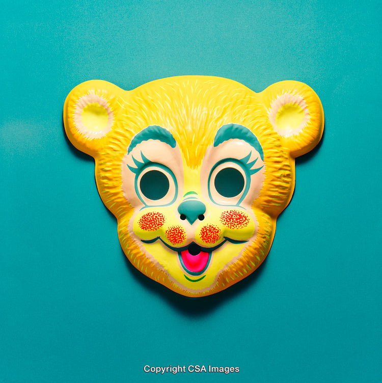Yellow Bear Shaped Mask with Playful Design on a Blue Background